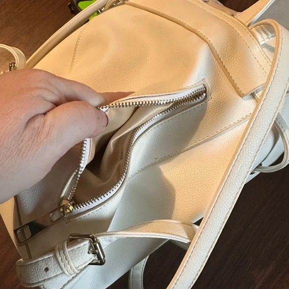 Lionel Backpack Purse. Cream. Snap Closure. Pockets. Adjustable Straps. - Picture 4 of 7